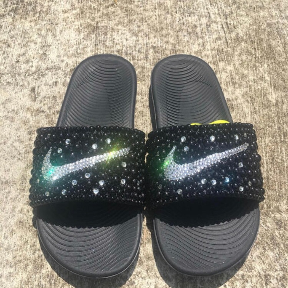 Custom made bling Nike slides.